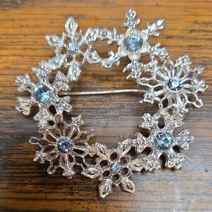 Elegant Silver Snowflake Brooch